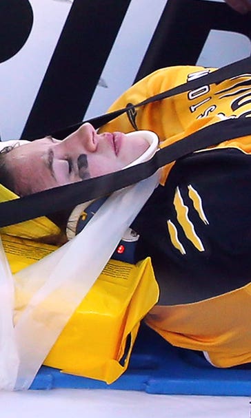 College hockey teams take to the ice in show of support for Denna Laing